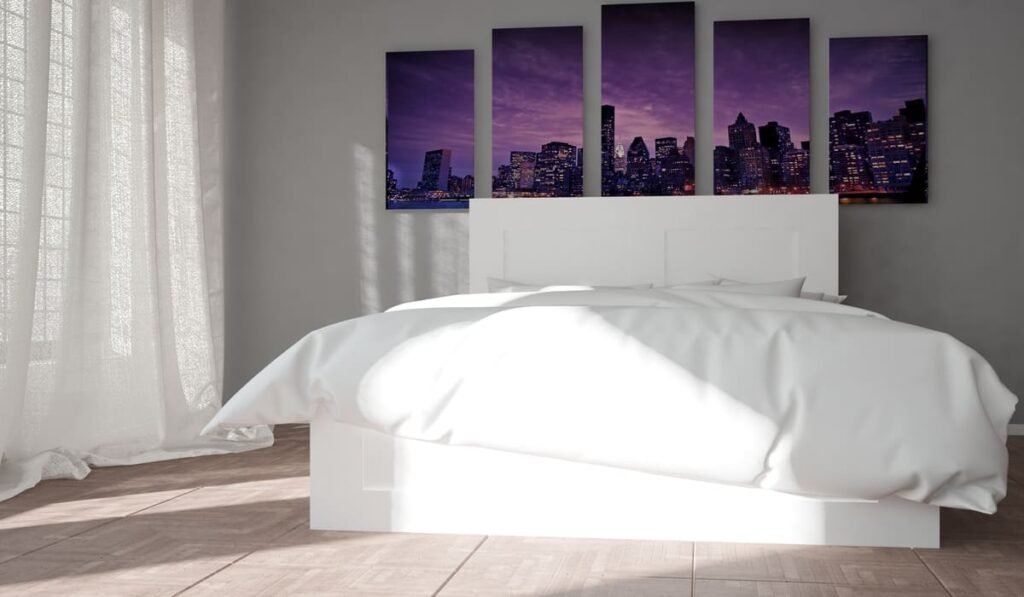 Triptych canvas panels on bedroom wall