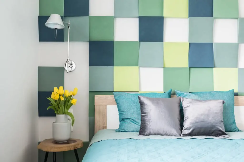 Dopamine decor bedroom with colorful bedding, bright accents and fresh tulips